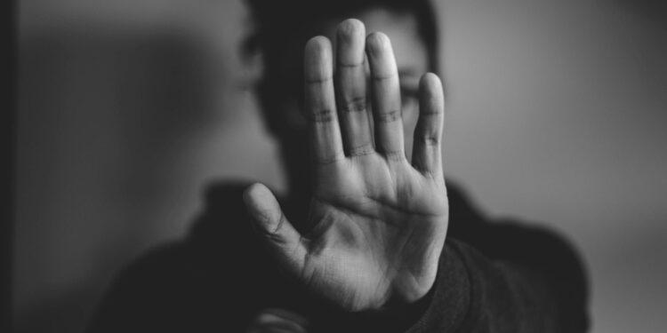 close-up photography of person lifting hands