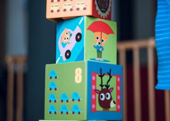 child building an four boxes